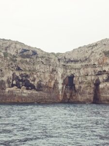 Majestic cliffs of La Mola in Formentera, a natural wonder offering personalized excursions to explore Formentera's rugged beauty with Iatu Boats.